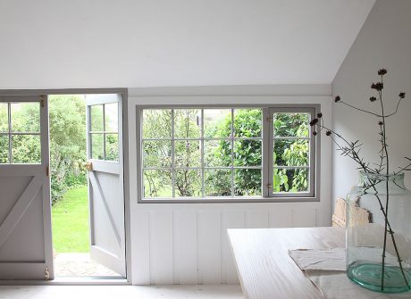 Beautiful summerhouse with wooden floor and windows, and part pitched ceiling