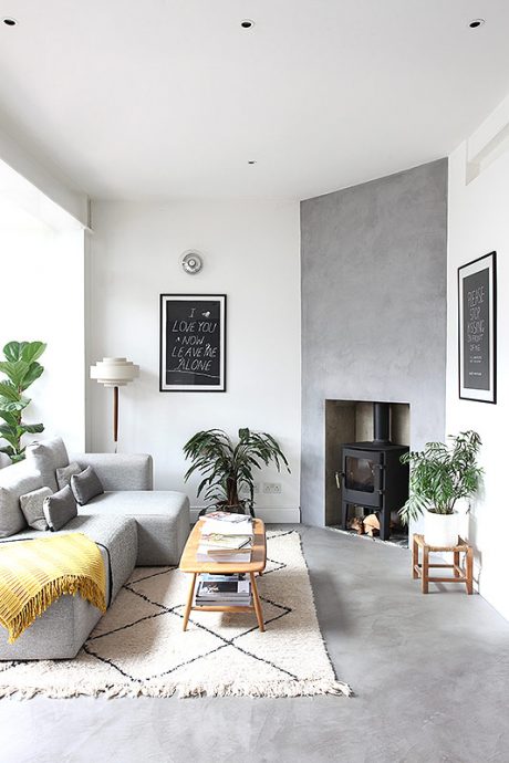 Cosy, light living room with concrete floor at Victorian House in Hackney, East London