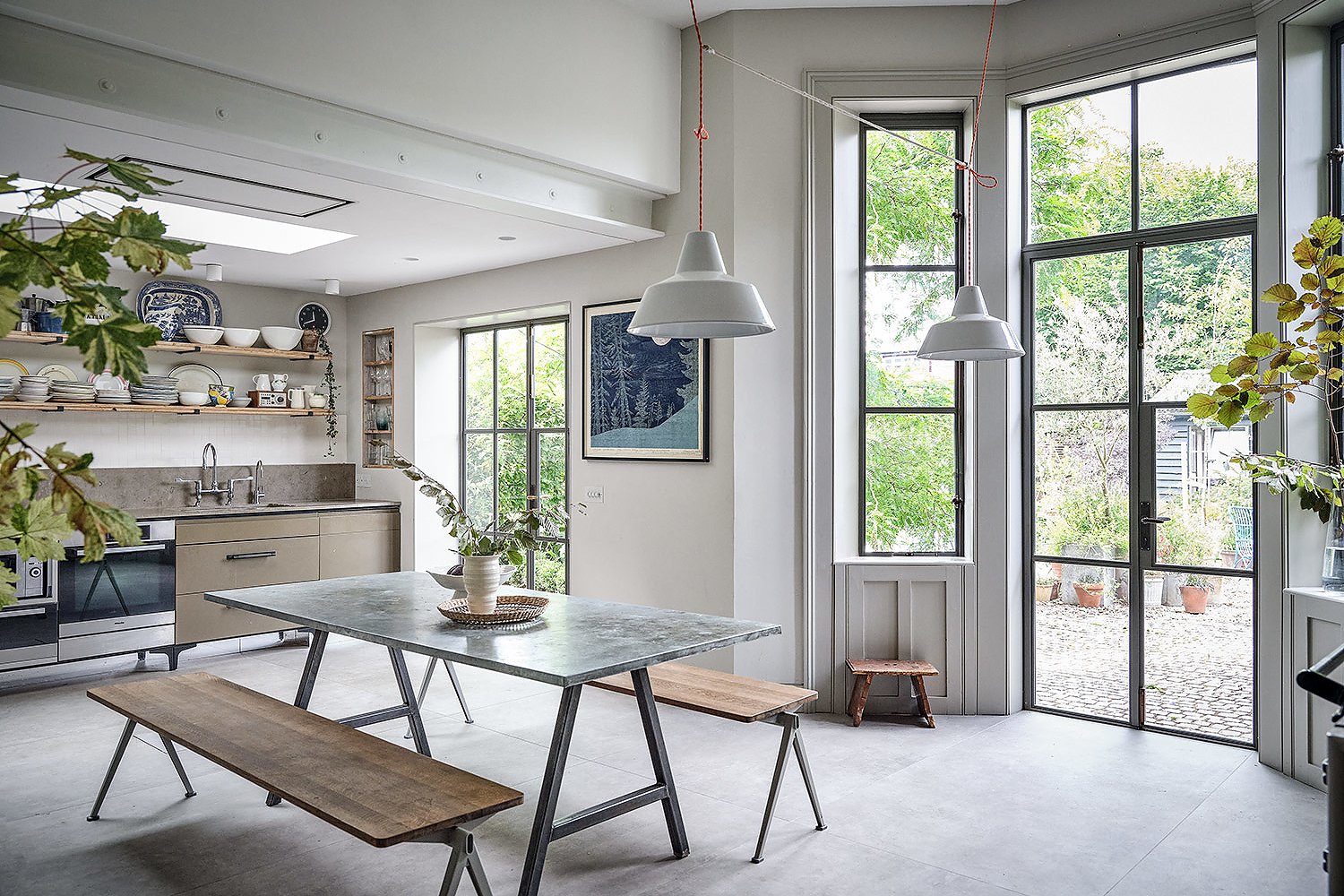 Stylish kitchen/dining space with large windows and lots of light at Victorian house in East Dulwich