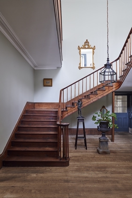 Beautiful hallway with sweeping staircase